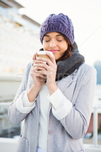 Smiling woman with take-away coffee Stock photo © wavebreak_media