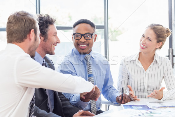 Empresário aperto de mãos colegas reunião escritório homem Foto stock © wavebreak_media