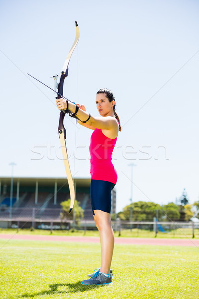 Femenino atleta tiro al arco estadio mujer Foto stock © wavebreak_media