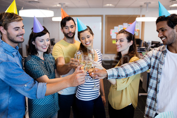 Creative business team having a toast on colleges birthday Stock photo © wavebreak_media