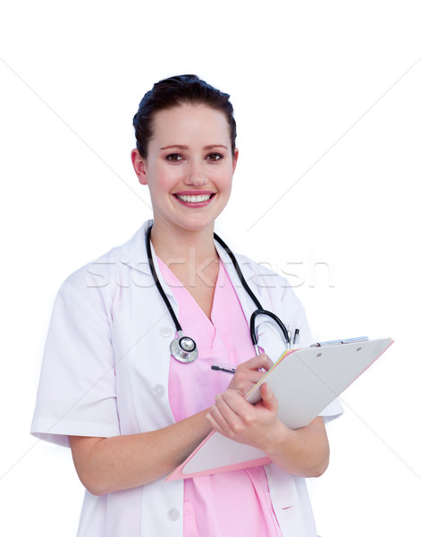Portrait a smiling female doctor writing notes Stock photo © wavebreak_media
