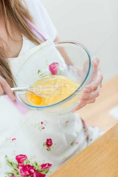 Close-up of a teen woman preparing a cake in the kitchen Stock photo © wavebreak_media