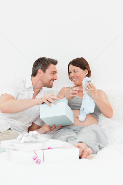 Femme offrant cadeau femme maison sourire [[stock_photo]] © wavebreak_media