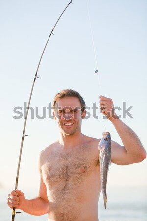 Stock photo: Serene woman relying on a blank panel against a white background