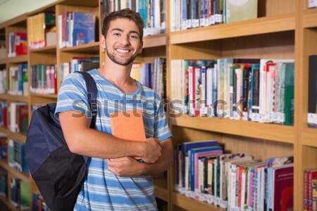 Zdjęcia stock: Uśmiechnięty · mężczyzna · student · półka · biblioteki