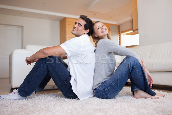 Vue de côté séance tapis amour couple [[stock_photo]] © wavebreak_media