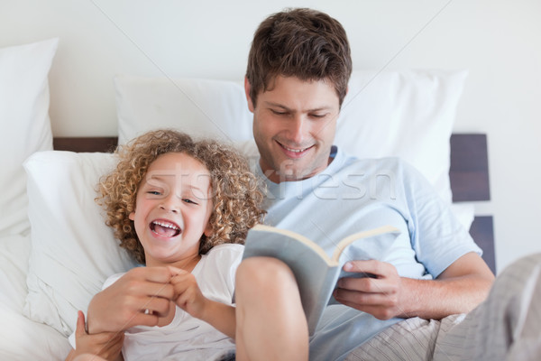 Father reading bedtime story for his child Stock photo © wavebreak_media