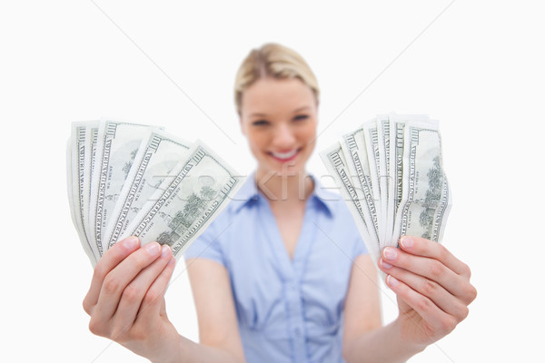 Woman holding money in her hands against a white background Stock photo © wavebreak_media