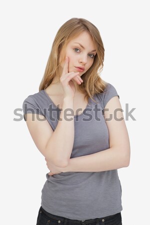 Woman standing while looking at camera against a white background Stock photo © wavebreak_media