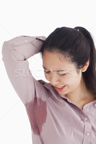 Distressed woman looking at sweat patches Stock photo © wavebreak_media
