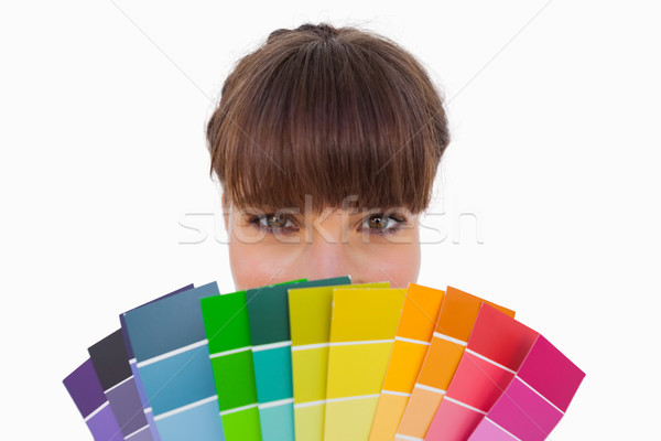 Happy woman with fringe showing colour charts close up Stock photo © wavebreak_media