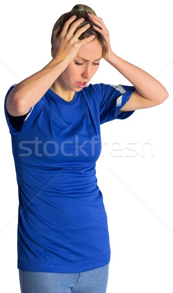 Stock photo: Disappointed football fan in blue jersey