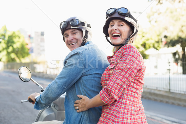 Heureux maturité couple équitation ville [[stock_photo]] © wavebreak_media