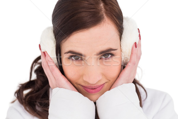 Pretty brunette with ear muffs Stock photo © wavebreak_media