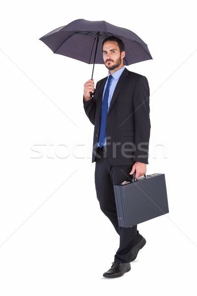 Geschäftsmann Anzug halten Dach Aktentasche weiß Stock foto © wavebreak_media