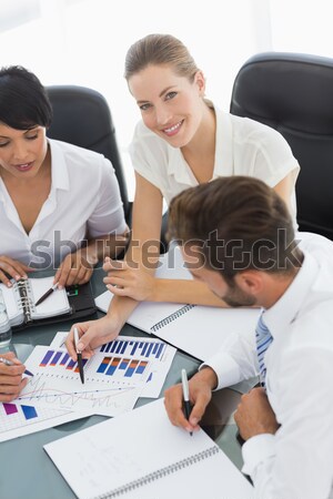 Salesperson pointing something on booklet Stock photo © wavebreak_media