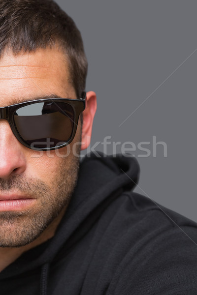 Criminal with sunglasses looking at camera  Stock photo © wavebreak_media