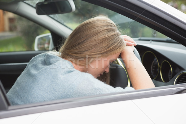 Tired woman asleep on steering wheel  Stock photo © wavebreak_media