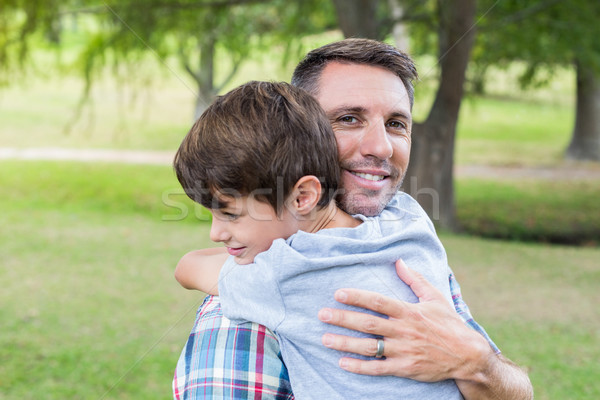 Stock photo: Father and son hugging in the park