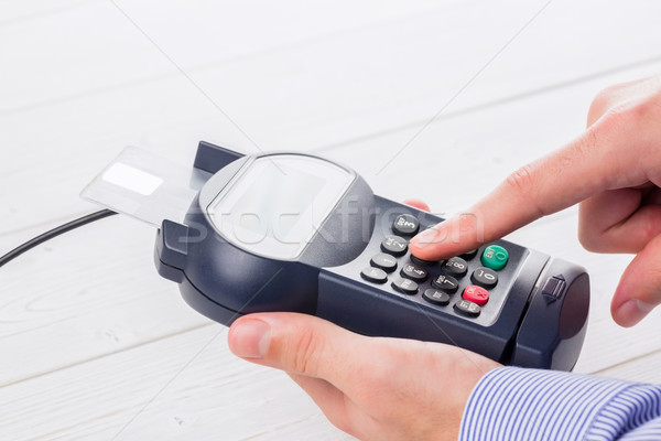 Man entering his pin on terminal Stock photo © wavebreak_media