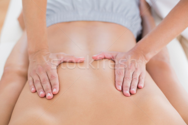 Physiotherapist doing back massage to her patient Stock photo © wavebreak_media
