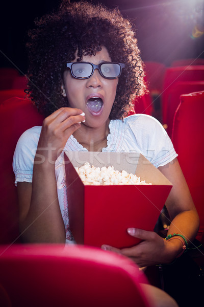 Surprised young woman watching a 3d film Stock photo © wavebreak_media