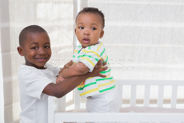 Portrait of a babyboy playing with his brother in his bed Stock photo © wavebreak_media
