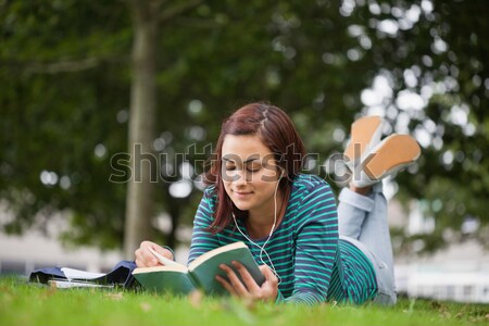 Digital composite image of math equation with smiling female college student in background Stock photo © wavebreak_media