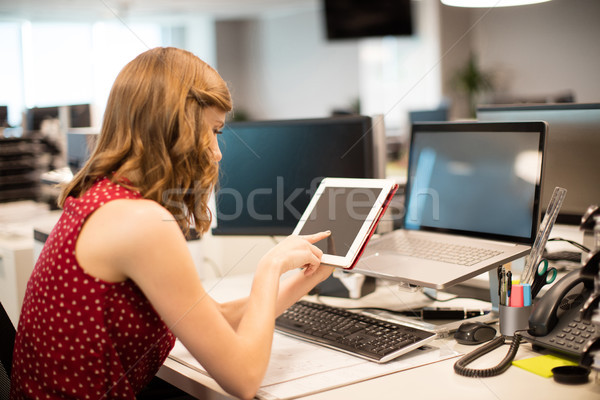 Side view of businesswoman using digital tablet in office Stock photo © wavebreak_media
