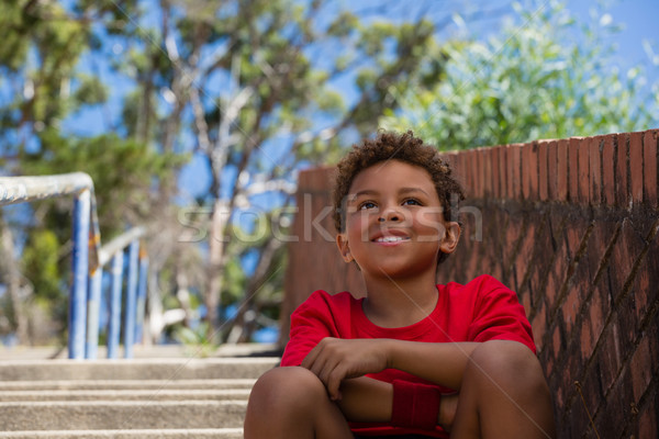 Boy sitting on staircase in the boot camp Stock photo © wavebreak_media