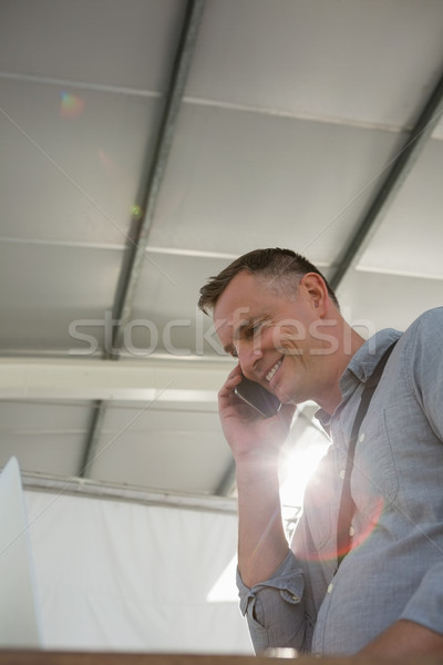 Low angle view of designer talking on smart phone Stock photo © wavebreak_media