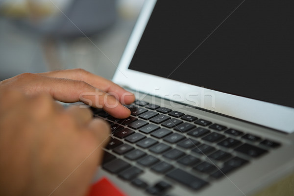 Cropped hands of man using laptop Stock photo © wavebreak_media