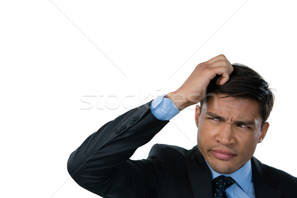 Close up of confused businessman with hand in hair Stock photo © wavebreak_media