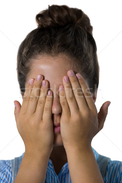 Teenage girl covering her eyes Stock photo © wavebreak_media