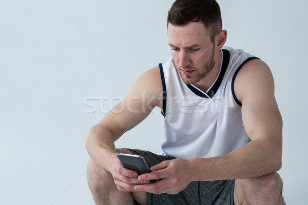 Gracz telefonu komórkowego biały telefonu człowiek sportu Zdjęcia stock © wavebreak_media