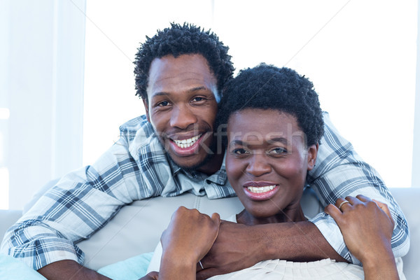 Happy couple hugging at home Stock photo © wavebreak_media