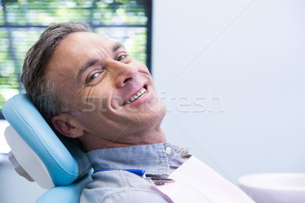 Ritratto sorridere uomo seduta sedia dentista Foto d'archivio © wavebreak_media