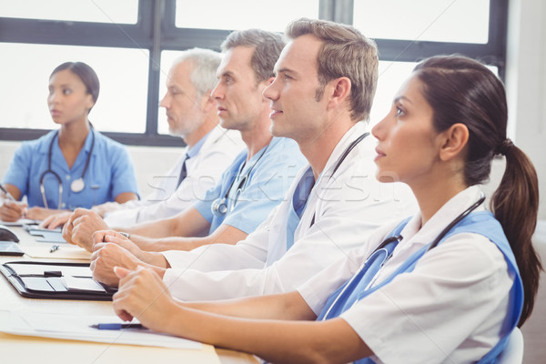 Medical team listening in conference room Stock photo © wavebreak_media