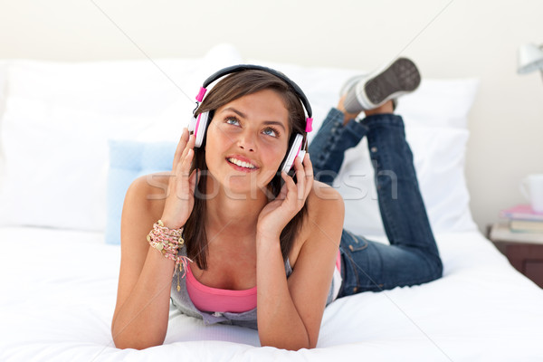 Smiling teenage girl listening to the music Stock photo © wavebreak_media