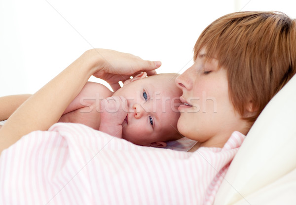 Mother sleeping with her newborn baby Stock photo © wavebreak_media