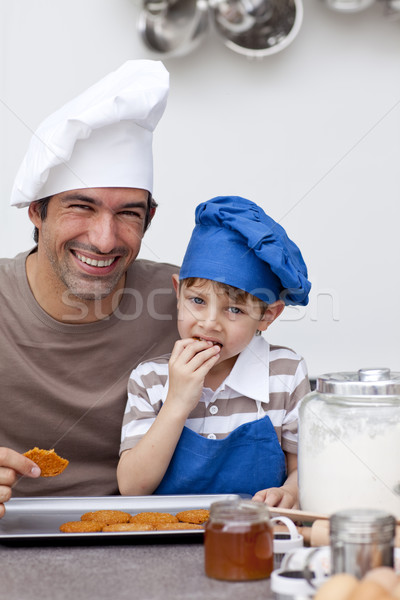 Father and son eating home-made cookies Stock photo © wavebreak_media