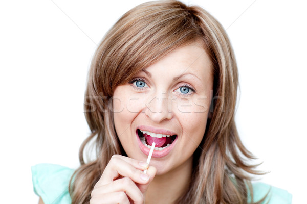 Joyful woman holding a lollipop  Stock photo © wavebreak_media