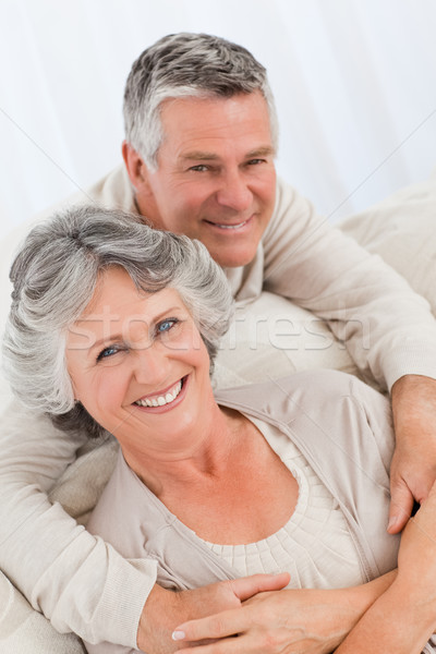 Mature couple looking at the camera at home Stock photo © wavebreak_media