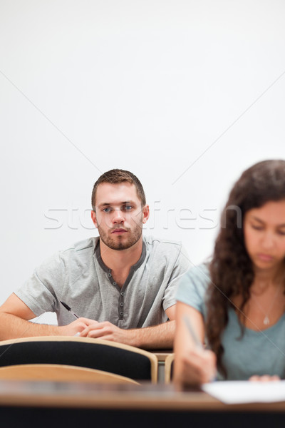 Portrait of a serious handsome student in an amphitheater Stock photo © wavebreak_media