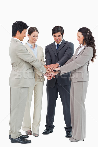 Businessteam performing self motivation ritual against a white background Stock photo © wavebreak_media