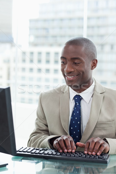 Portrait of an office worker using a computer in his office Stock photo © wavebreak_media