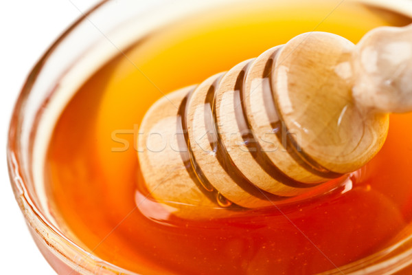 Honey dipper outgoing a bowl Stock photo © wavebreak_media