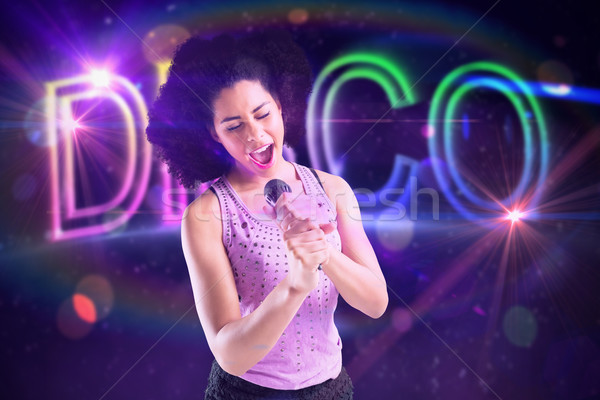 Immagine bella ragazza cantare digitalmente Foto d'archivio © wavebreak_media