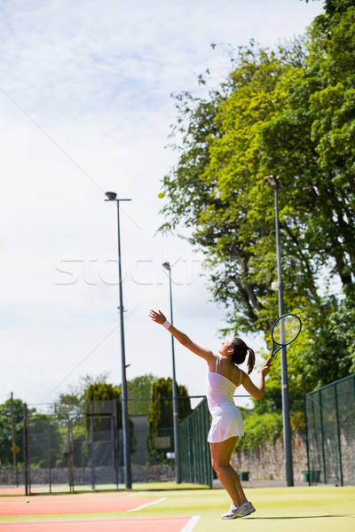 Pretty tennis player about to serve Stock photo © wavebreak_media