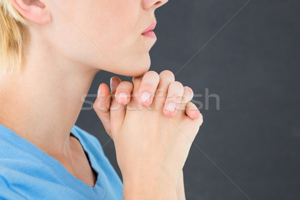 Pretty blond woman praying Stock photo © wavebreak_media